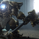 Overwatch's Reinhardt stands before an army of combat robots in this screenshot.
